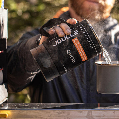 Joulle electric kettle pouring hot water outdoors, camping gear from Stoke Voltaics